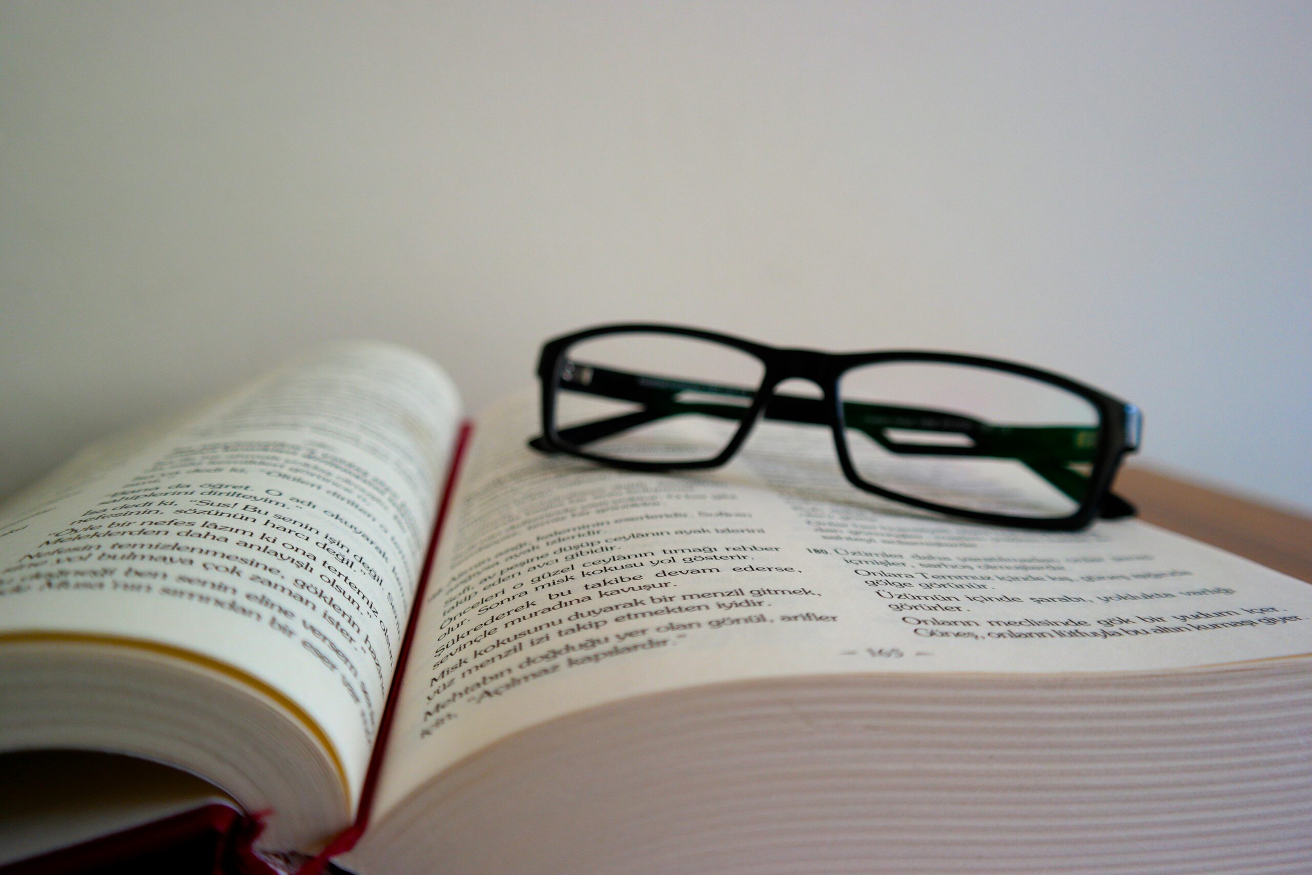 A book and glasses